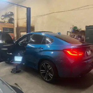 Blue BMW in repair